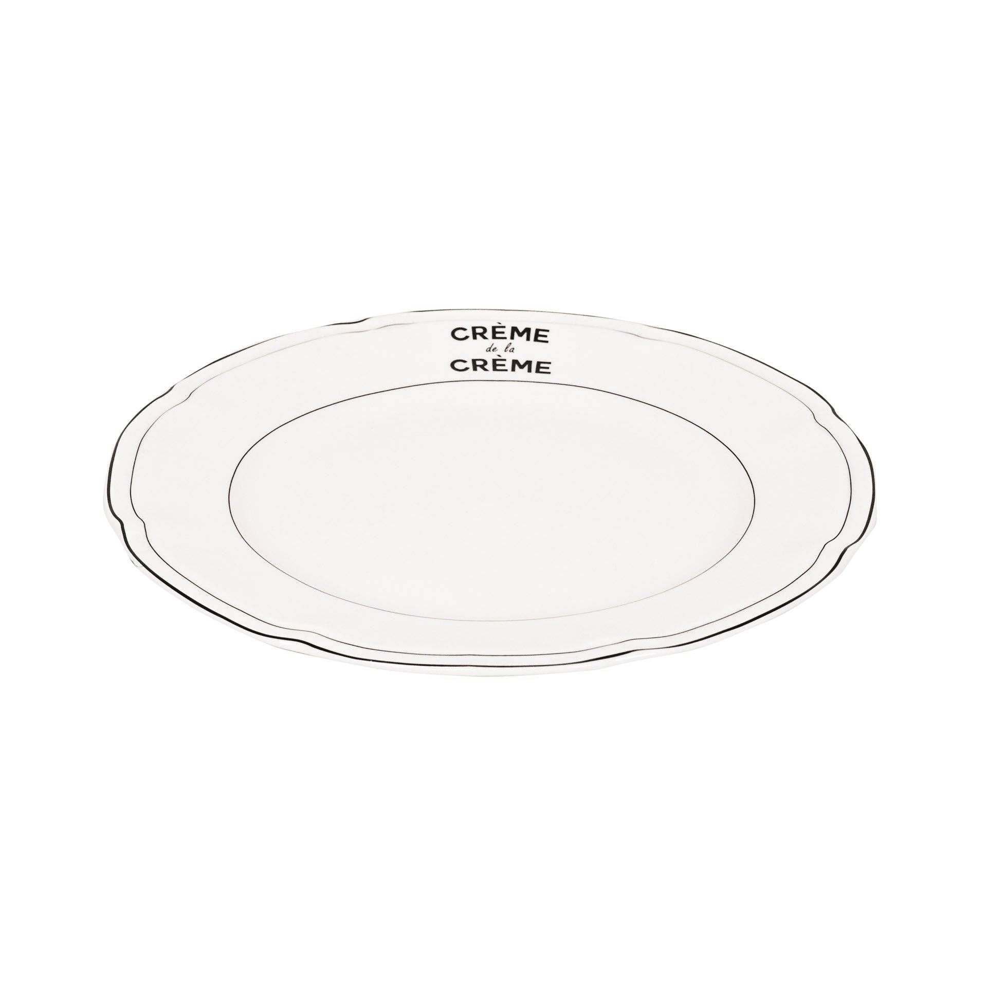 Λευκό κεραμικό πιάτο House Vitamin με τη μαύρη επιγραφή "Crème de la Crème" και χρυσό περίγραμμα στο χείλος.