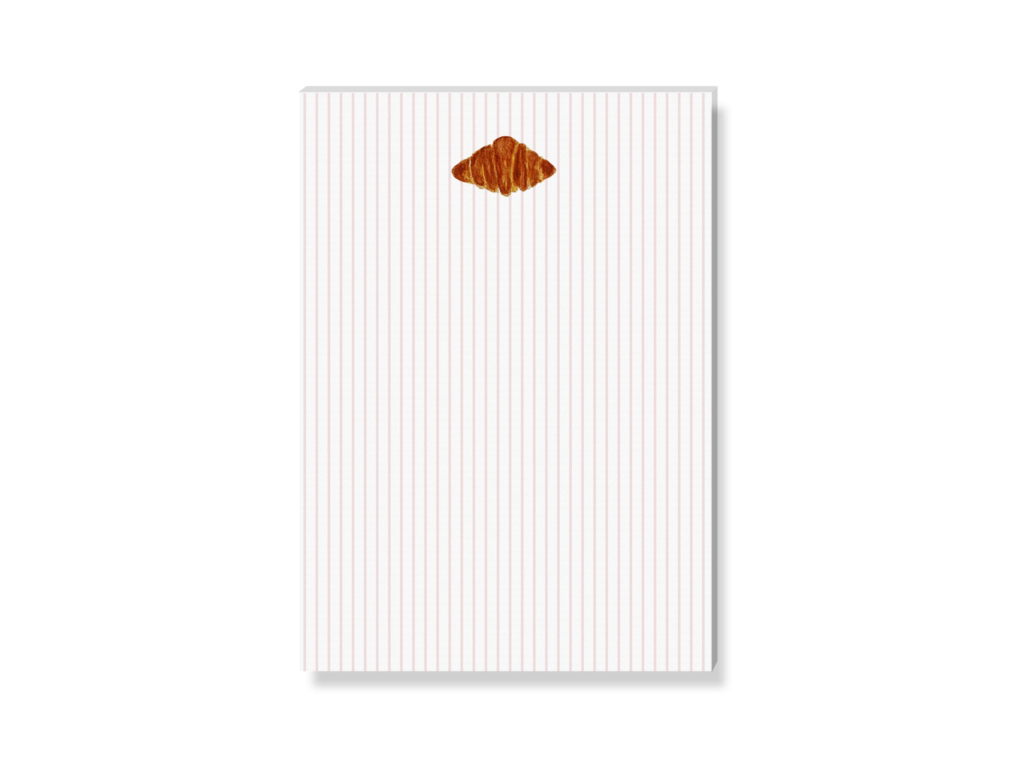 Χειροποίητο μπλοκ σημειώσεων SANS.design με σχέδιο κρουασάν σε τεχνική watercolor, 50 φύλλα, μέγεθος A6.