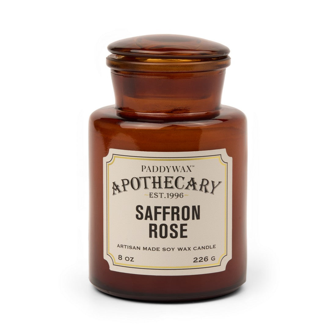 Αρωματικό κερί σόγιας Paddywax Apothecary Saffron Rose 226g σε κεχριμπαρένιο γυάλινο βάζο φαρμακείου.